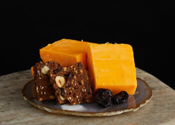 This is a picture of Hook's Ten-Year Aged Cheddar cheese, offered by Fromagination.