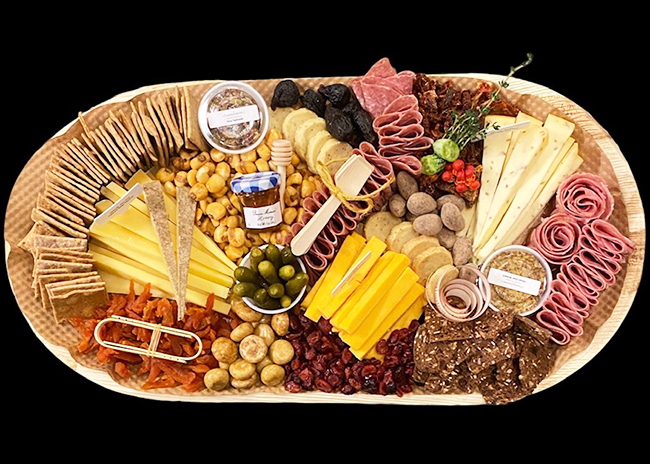 This is a picture of a Fromagination Artisan Cheese and Charcuterie Tray.