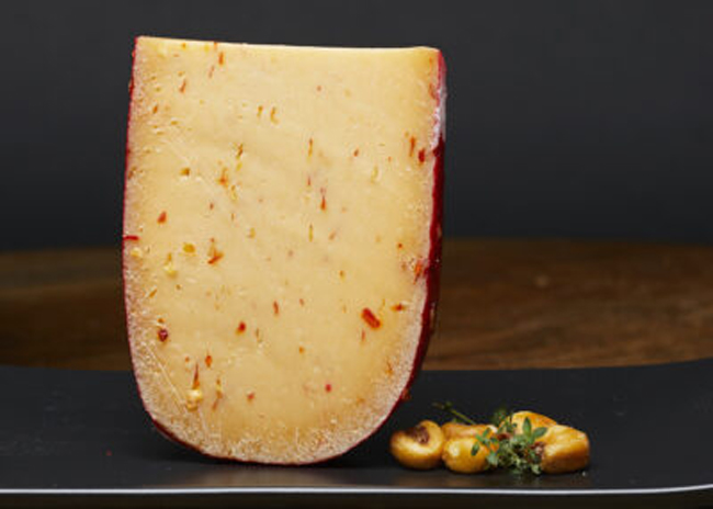This is a picture of Sriracha Gouda cheese, offered by Fromagination.