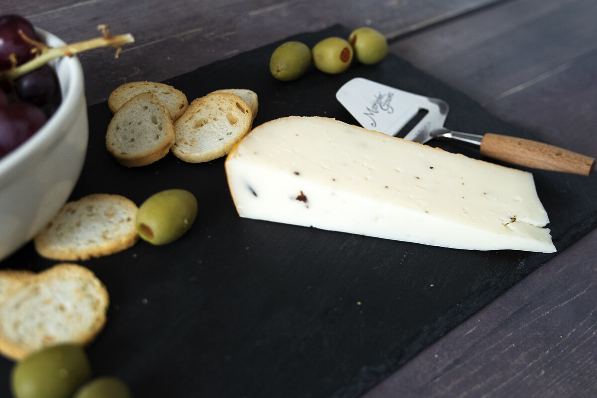 This is a picture of Marieke Truffle Gouda cheese, offered by Fromagination.