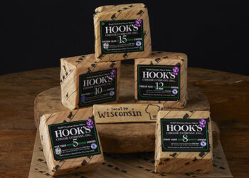 This is a picture of five Hook's aged Cheddar cheeses, offered by Fromagination.