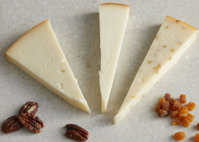 This is a picture of three Marieke Gouda cheeses, offered by Fromagination.