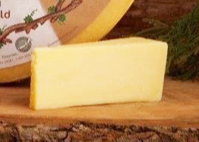 This is a picture of The Stag Cheddar cheese, featured by Fromagination