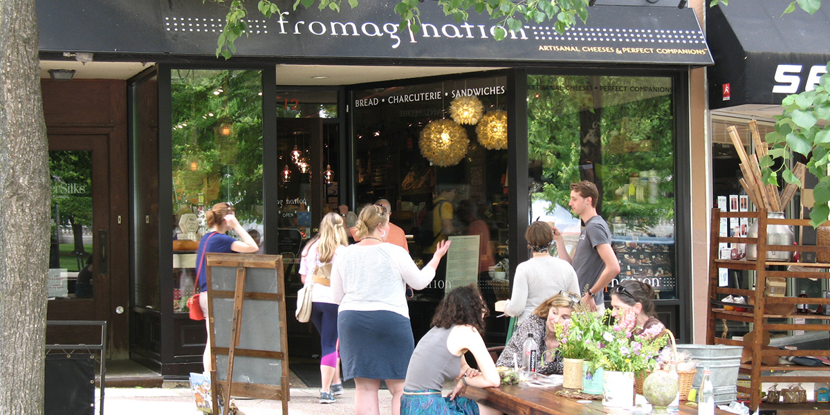 This is a picture of the Fromagination shop exterior in summer