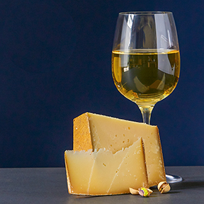 This is a picture of cheese with wine.
