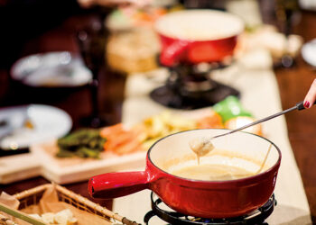 This is a picture of a fondue fork and fondue pot from Fromagination's Fondue at Home class.