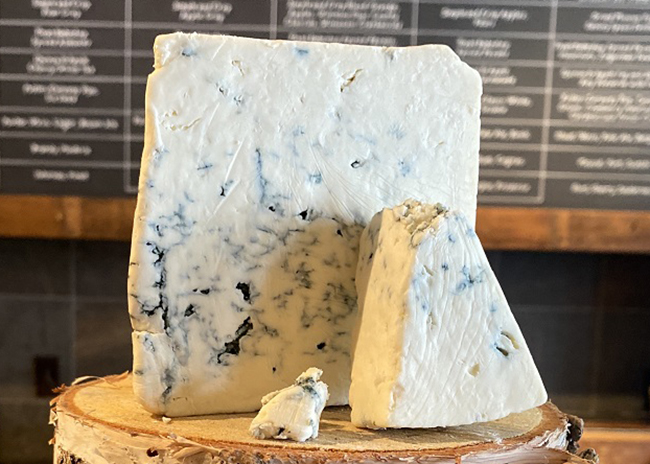This is a picture of Buttermilk Blue Affinee cheese, featured at Fromagination.