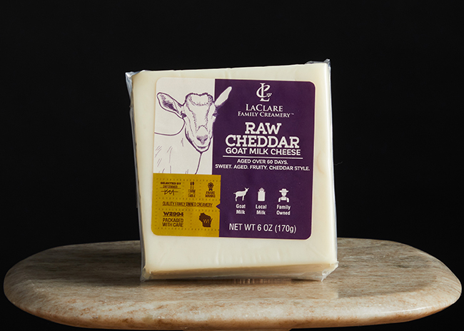 This is a picture of LaClare Raw Goat Milk Cheddar cheese, offered by Fromagination.