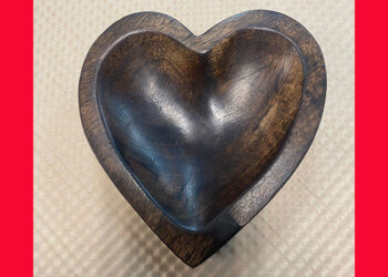 This is a picture of a wooden heart-shaped bowl, offered by Fromagination.