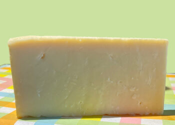 This is a picture of Woolly Elsie Aged Cheddar cheese, offered by Fromagination.