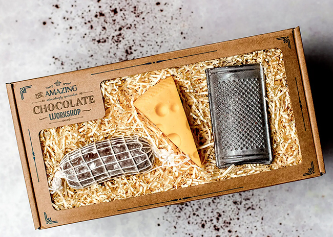 This is a picture of Unique Chocolate Gift: Salami, Cheese & Grater, offered by Fromagination.