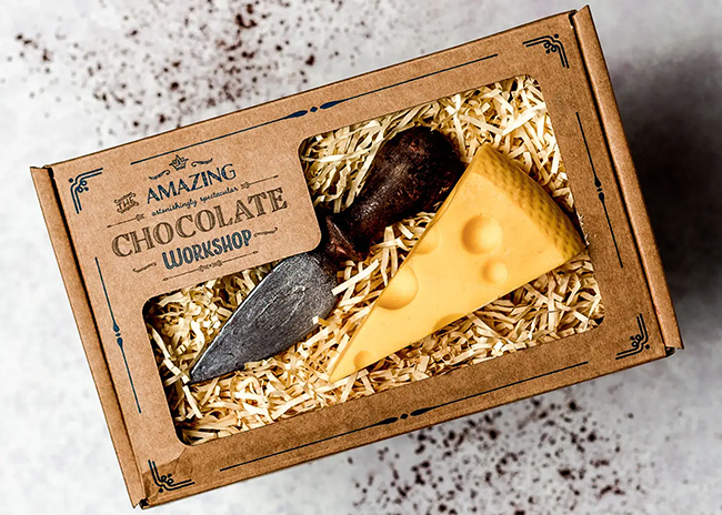 This is a picture of Unique Chocolate Gift: Cheese & Slicer or Grater, offered by Fromagination.