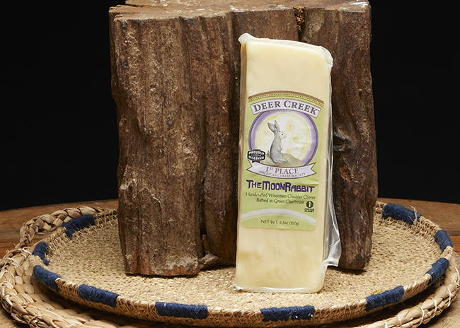 This is a picture of Deer Creek's Moon Rabbit Cheddar Cheese, offered by Fromagination.