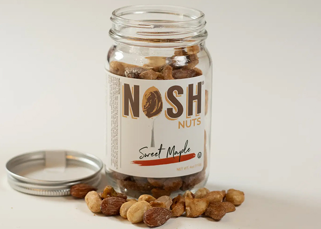 This is a picture of Sweet Maple Nosh Nuts, offered by Fromagination.