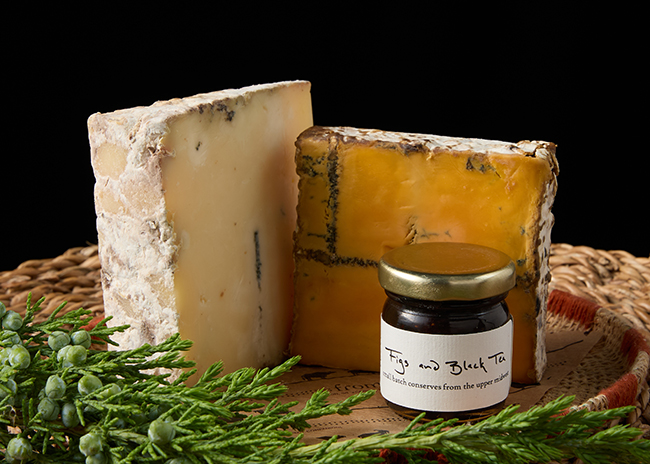 This is a picture of Roelli Cheese Haus' Dunbarton Blue and Red Rock cheeses, offered by Fromagination.