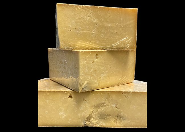 This is a picture of Roelli Cheese Haus' Wisconsin Swiss Raclette cheese, offered by Fromagination.