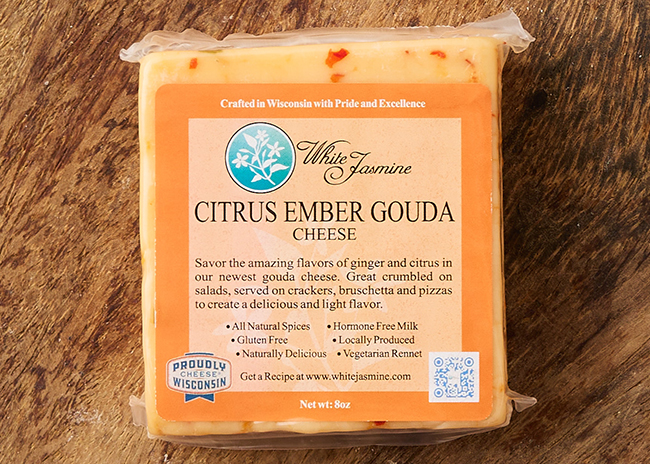 This is a picture of White Jasmine Citrus Ember Gouda Cheese, offered by Fromagination.