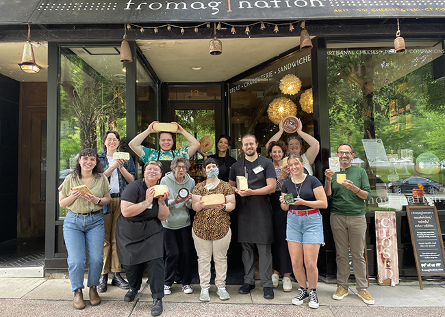 About Us.Fromagination staff in June 2024.650x464.72res This is a picture of the Fromagination staff outside the shop in June 2024.