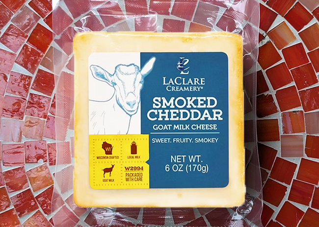 This is a picture of LaClare Creamery's Goat Milk Smoked Cheddar cheese, offerd by Fromagination.