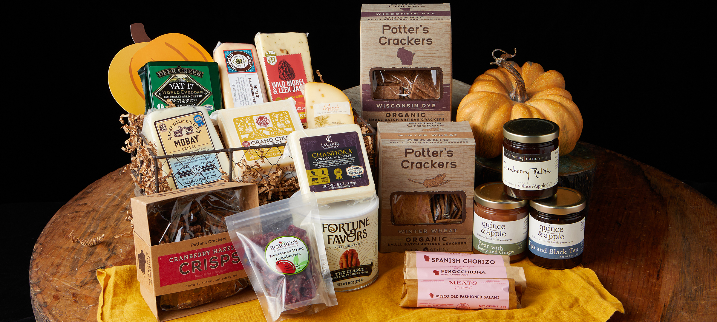 Hero.Wisconsin Sampler Gift Set.2400x1080.72res The Wisconsin Sampler Gift Set is chock full of great cheeses and companion items to create a grand cheese board.